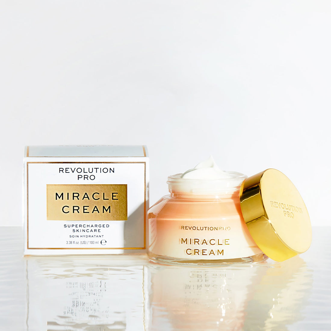 Revolution Beauty Miracle Cream 100ml moisturizer jar with white lid and smooth cream visible inside.