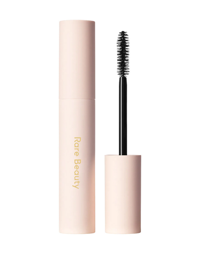 Rare Beauty Perfect Strokes Universal Volumizing Mascara wand with black mascara on bristles, showcasing the makeup product in a tube