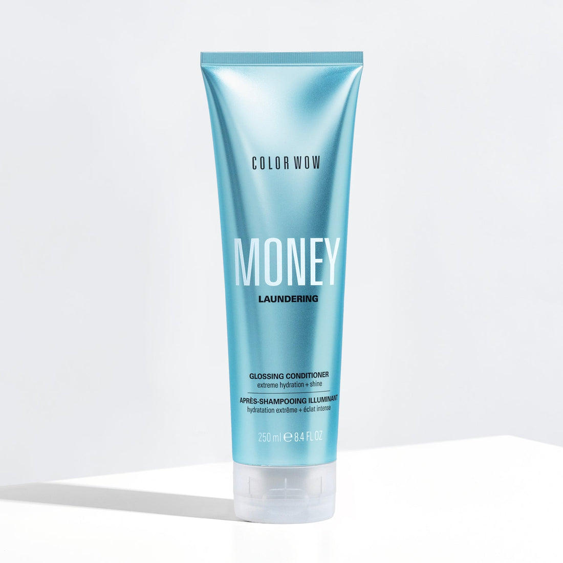 Color Wow Money Laundering Glossing Conditioner 250ml, a shiny, smooth conditioner in a white bottle with a pump dispenser.